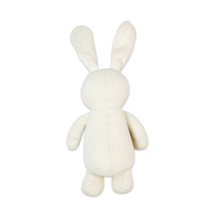 White plush bunny toy on a white background