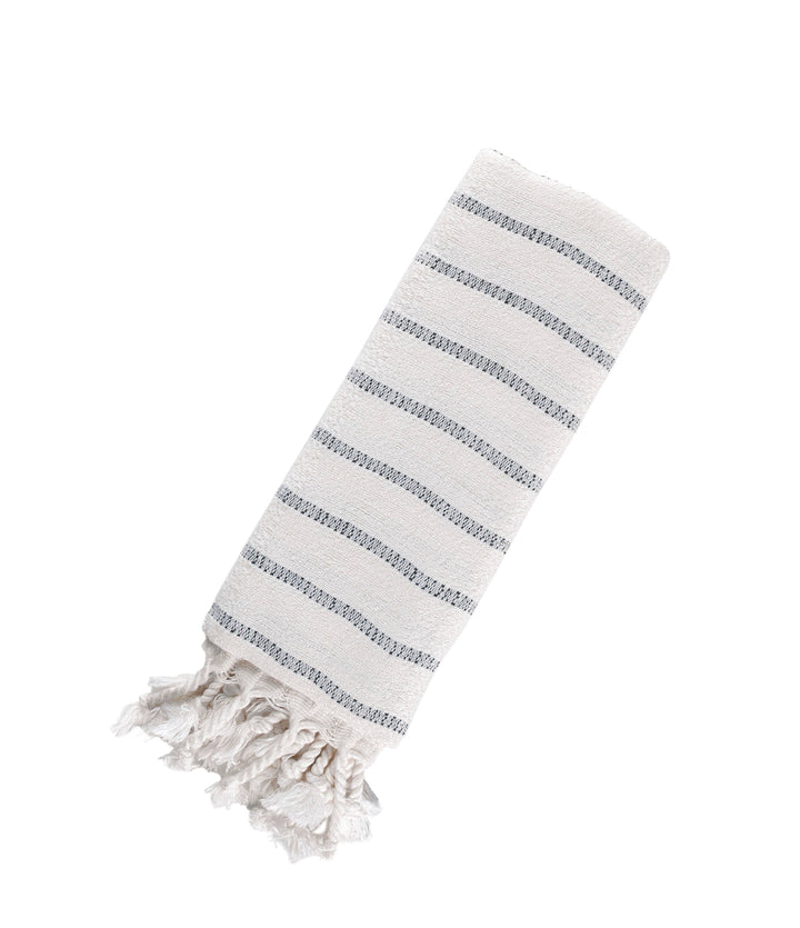 Striped towel with tassels on a white background