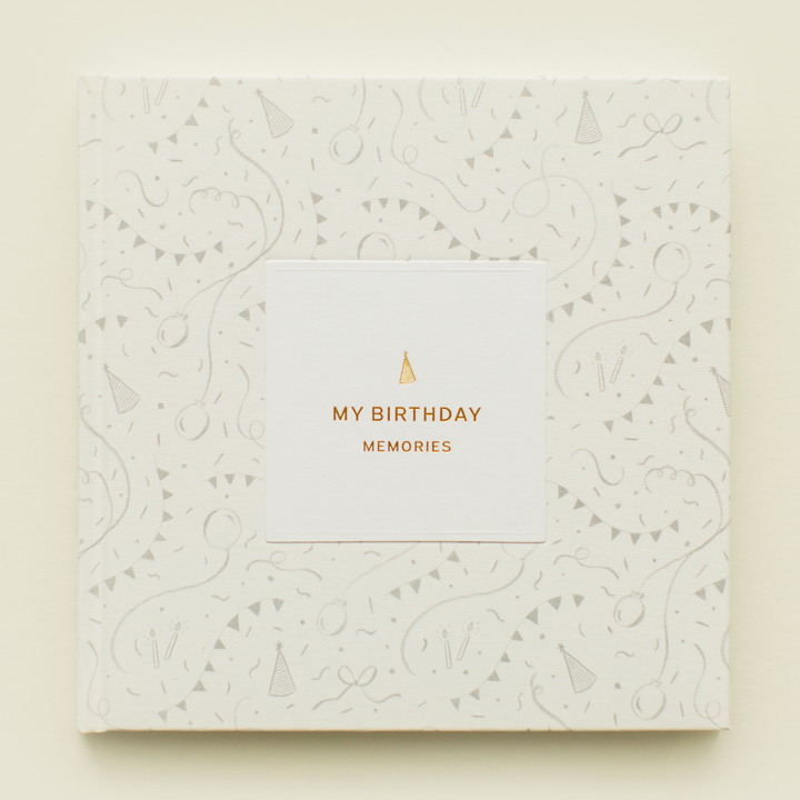 White book with gold text &