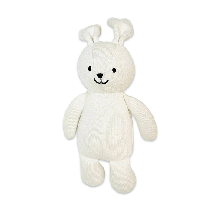 White plush toy with bunny ears on a white background