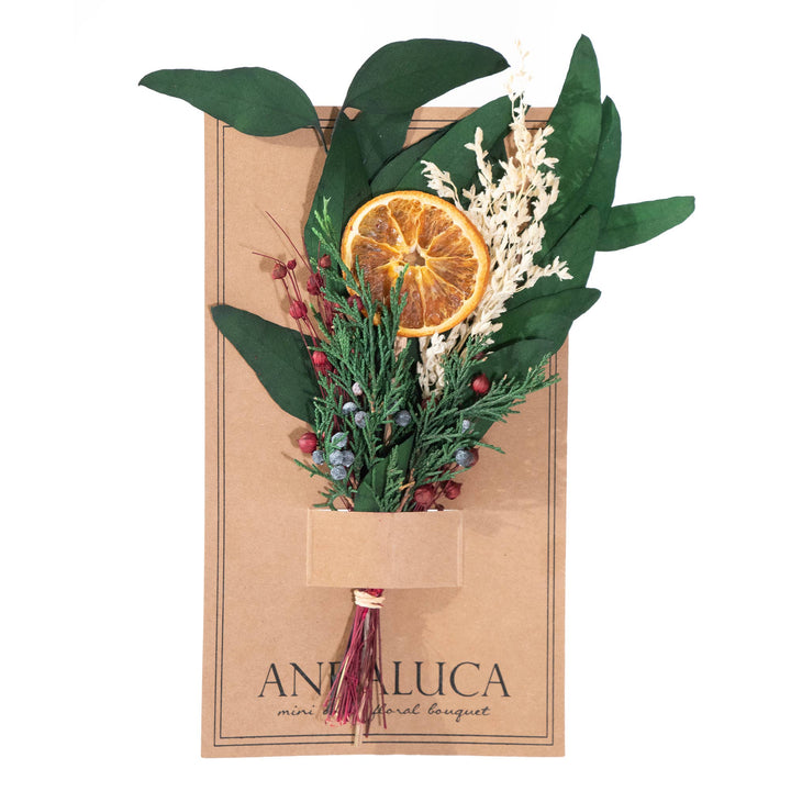 Mini floral bouquet with dried oranges, berries, and leaves in a cardboard packaging with &