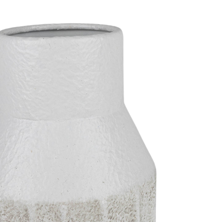 Textured ceramic vase on a white background