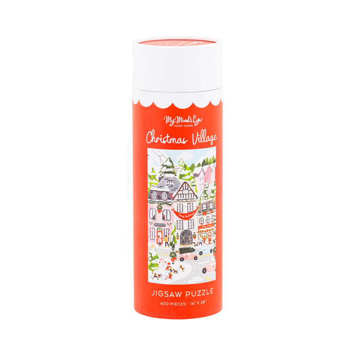 Jigsaw puzzle with Christmas village design on the packaging on a white background