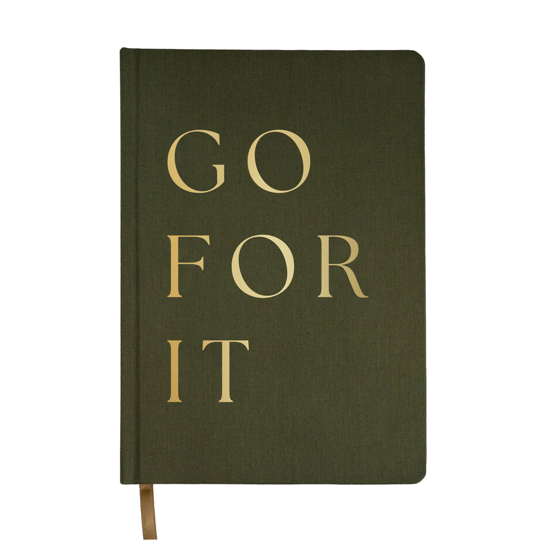 Our Go For It olive green and gold fabric journal is a chic, stylish, and easy to write on notebook. There's no better place to jot down motivational notes, goals, inspirational quotes, lists, and great ideas.  DETAILS:  Size: 8.1 x 5.6 x 0.6” Design: Go For It Olive Fabric Journal with Gold Foil Details 100gsm Uncoated Lined Paper Ribbon Bookmark in Gold 100 Pages Front and Back (200 Total) Designed in the USA