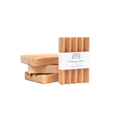 Our cedar soap dishes are a beautiful and practical way to preserve your bar soap. Our natural, handcrafted soap doesn’t contain chemicals that prevent “melting” if the bar is left sitting in water.  Handcrafted in the US, these soap dishes are designed to allow water to drain through while minimizing contact with the soap, extending the life of the bar. These are an excellent complement to our line of bar soaps.  The cedar soap dishes measure 2.75" x 4".