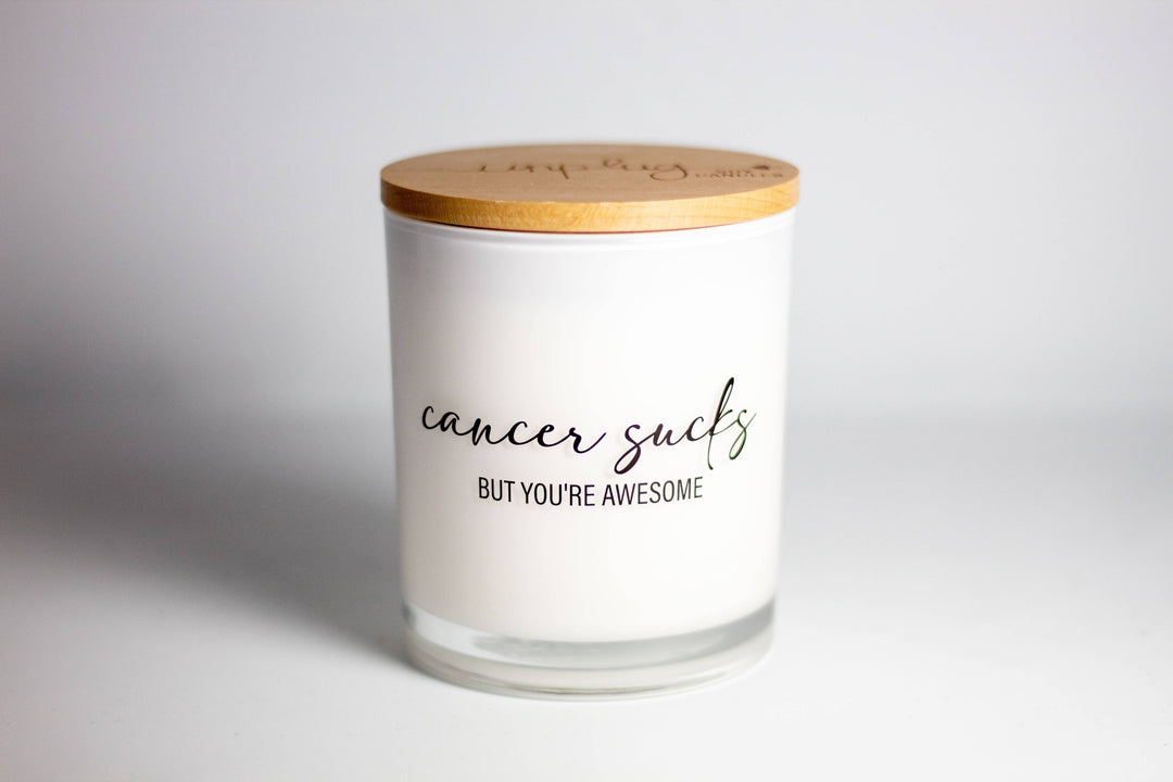 This printed candle reads "Cancer sucks but you&
