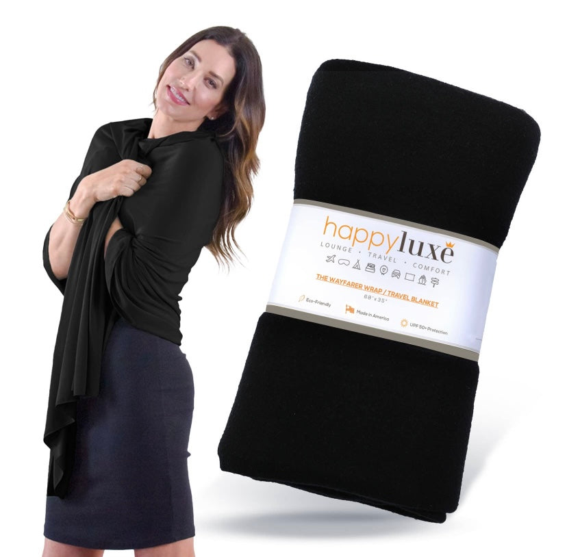 The Wayfarer travel wrap in classic jet black is a fashionable and versatile wrap and travel blanket, also can be used as a scarf, cover-up, pashmina, and so much more. This wrap is made from luxurious eco-friendly Tencel fiber material, a plant-based textile and cellulose fiber that is made from sustainably harvested beech trees, is absorbent and breathable, and is resistant to fading, pilling, and wear. This amazing fabric is machine washable. 68 x 35 inches. Made in the U.S.A.