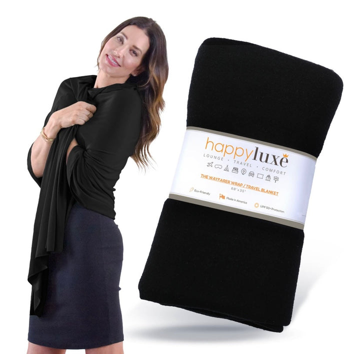 The Wayfarer travel wrap in classic jet black is a fashionable and versatile wrap and travel blanket, also can be used as a scarf, cover-up, pashmina, and so much more. This wrap is made from luxurious eco-friendly Tencel fiber material, a plant-based textile and cellulose fiber that is made from sustainably harvested beech trees, is absorbent and breathable, and is resistant to fading, pilling, and wear. This amazing fabric is machine washable. 68 x 35 inches. Made in the U.S.A.