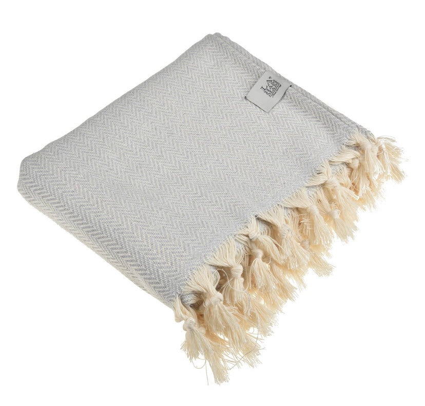 This gray 100% pure cotton throw is so soft and versatile.  It can be used as a light throw blanket, bath towel, beach or pool towel, picnic blanket, etc... Being so thin makes it very easy to carry around, keep it in the car or a backpack.  This pesthemal is highly absorbent and incredibly fast drying.  Its construction and unique material makes it thin, quick dry and multipurpose.  Unlike towels and blankets, it is very easy to carry around and is a must have item wherever you are headed!  Size: 72"x50"